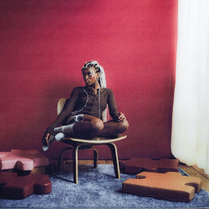 Em Describe, Hannah Jadagu mistura shoegaze, soul e folk com psicodelia e bedroom pop; letras íntimas encaram o amor como peso e refúgio.